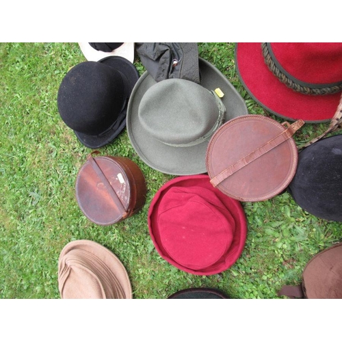 211 - A collection of hats, including bowler, vintage children's riding hats, a Herbert Johnson hat box an... 