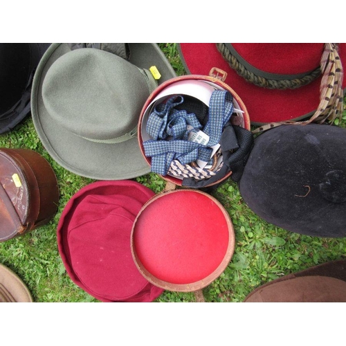 211 - A collection of hats, including bowler, vintage children's riding hats, a Herbert Johnson hat box an... 