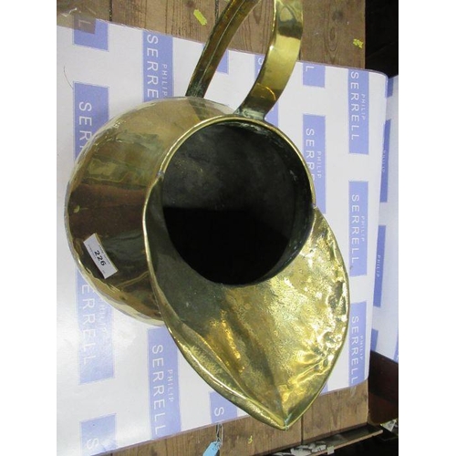 226 - An Antique style brass jug