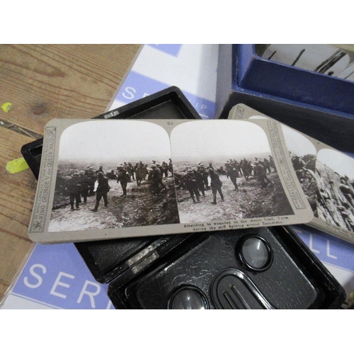 229 - A collection of stereoscopic viewers, together with boxed Great War stereoscopic cards