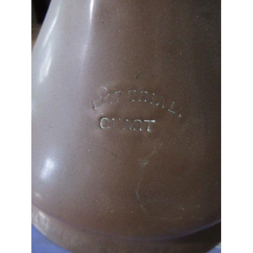 234 - A set of five graduated copper jugs