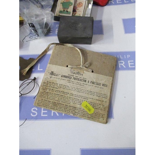 257 - A First Aid tin and contents, including Douglas Combined protractor and rule, coins, pewter box with... 