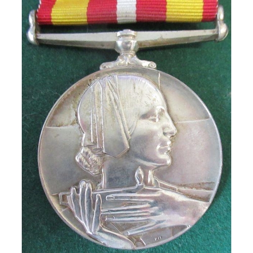 297 - British Red Cross, a Voluntary Medical Service medal, presented to Mrs Brenda J Daniels, with letter