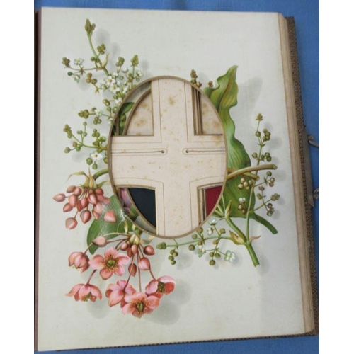 298 - A Victorian photograph album, with embossed leather cover and flowers to some pages