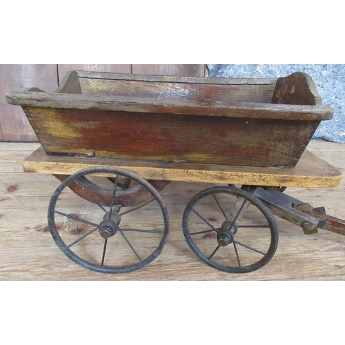 300 - An Antique dog cart, with metal wheels