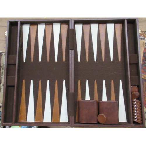 303 - A cased mah jong set, with plastic tiles, together with a travelling backgammon game