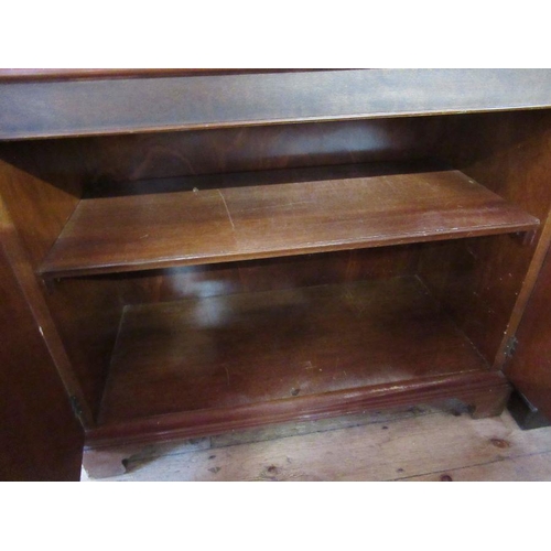 33 - A mahogany cabinet, with glazed upper section and cupboard to the base