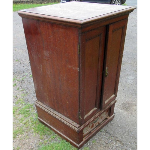 49 - A mahogany cupboard, fitted with a pair of doors over a drawer, width 27ins, depth 27ins, height 47.... 