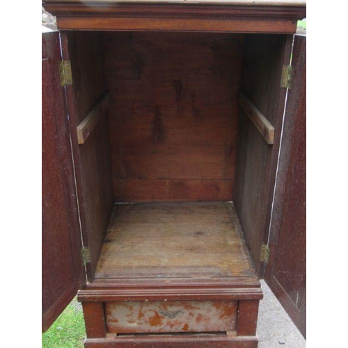 49 - A mahogany cupboard, fitted with a pair of doors over a drawer, width 27ins, depth 27ins, height 47.... 