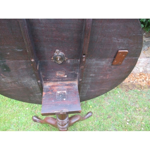 55 - A 19th century mahogany tilt top tripod table diameter 32ins