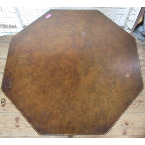 58 - A walnut octagonal table, raised on three bobbin turned legs, with circular undershelf, diameter 24.... 