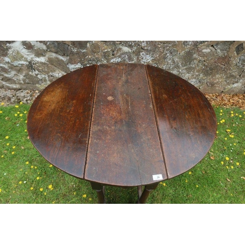 63 - An antique oak gate leg table width 35ins, length 40.5ins, height 28ins