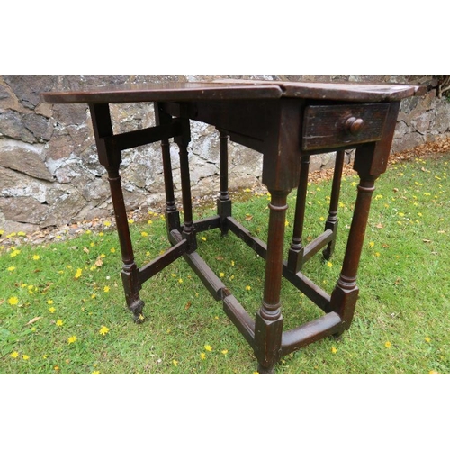 63 - An antique oak gate leg table width 35ins, length 40.5ins, height 28ins