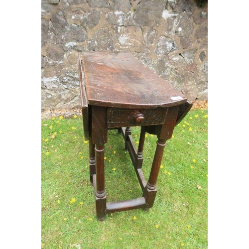 63 - An antique oak gate leg table width 35ins, length 40.5ins, height 28ins