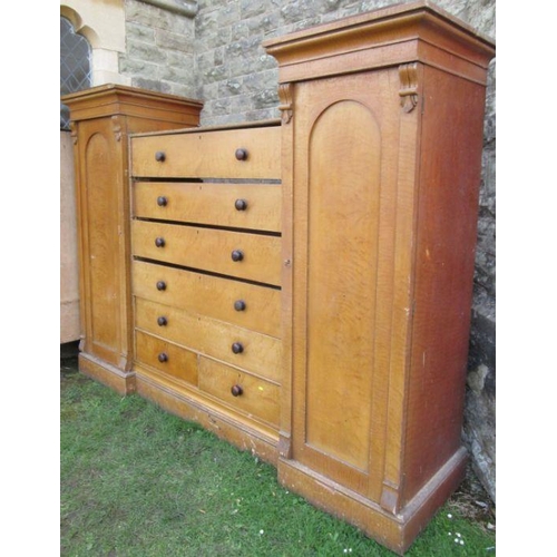 72 - A Victorian satinwood sentry box wardrobe, fitted with a central bank of drawers flanked by cupboard... 