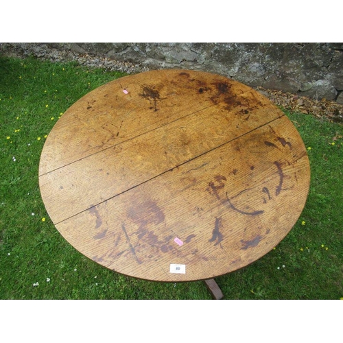 88 - An oak tripod table diameter 35ins height 28ins