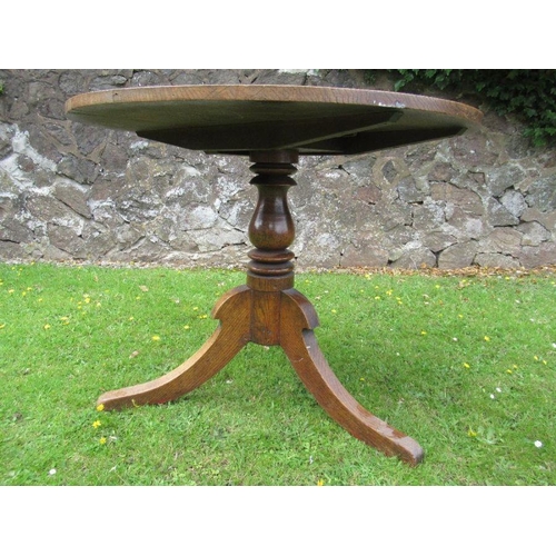 88 - An oak tripod table diameter 35ins height 28ins