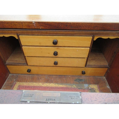 9 - A 19th century secretaire campaign chest, the upper section fitted with a short secretaire draw and ... 