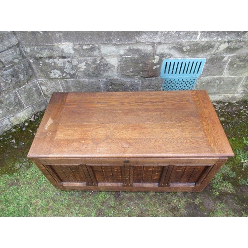 90 - An oak coffer having fielded panels to the front and sides  width 41.5ins, depth 21ins, height 21ins