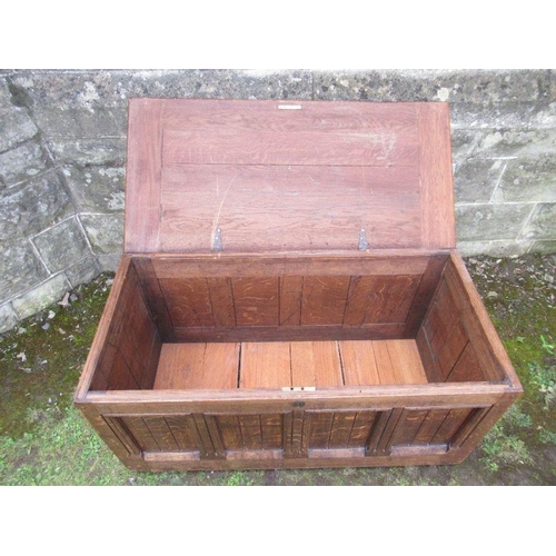 90 - An oak coffer having fielded panels to the front and sides  width 41.5ins, depth 21ins, height 21ins