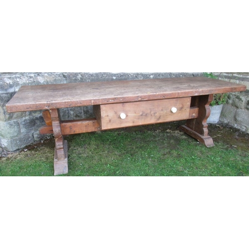 1 - An antique oak serving table, with a plank top raised on shaped legs united by a stretcher fitted wi... 