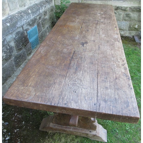 1 - An antique oak serving table, with a plank top raised on shaped legs united by a stretcher fitted wi... 