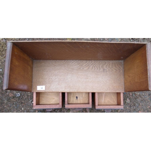 12 - A Cotswold style book trough, fitted with three drawers, width 20ins, height 14ins