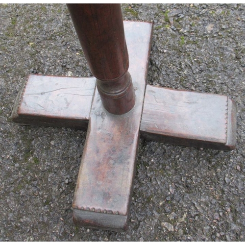 13 - A 17th century primitive yew wood and oak candle stand, the square oak top supported by a turned yew... 