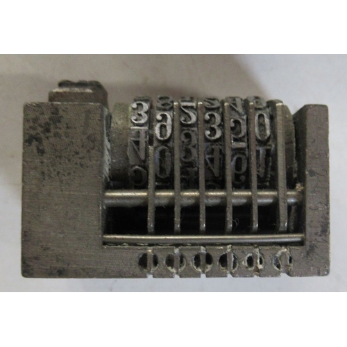 205 - Four vintage metal number printing blocks, together with a printing block with crest and a metal tob... 