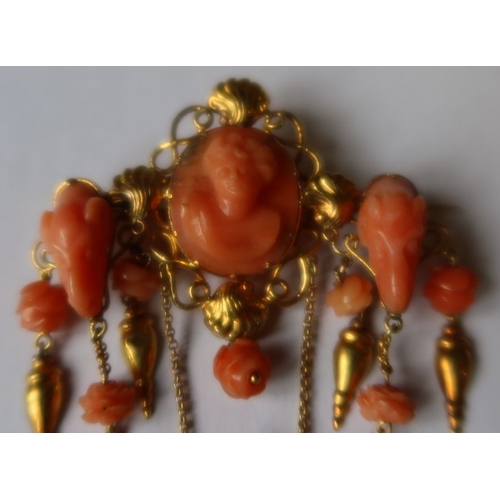 303 - A 19th century Italian carved coral and gold pendant brooch, having oval carved coral bust portrait,... 