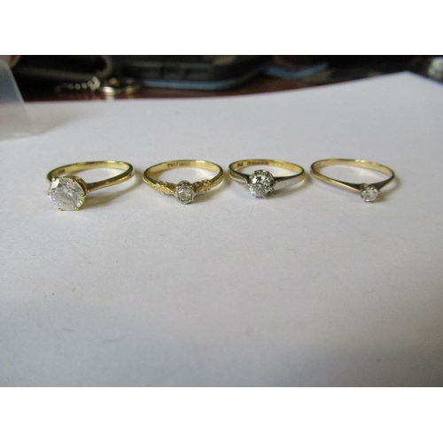 310 - Four solitaire rings, two in 18ct gold, weight 8g