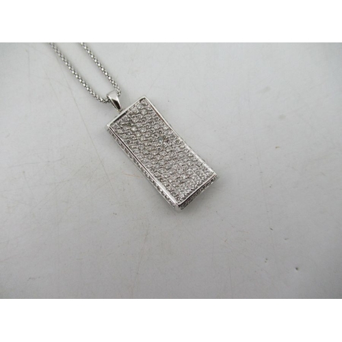 311 - A white gold and diamond pendant, with necklace chain, the chain stamped 750, the pendant made up of... 