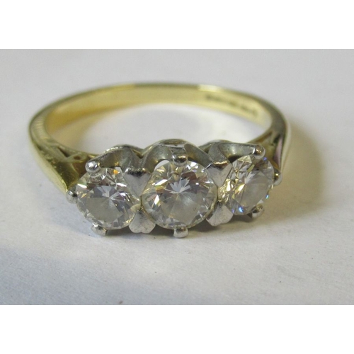 332 - A 18ct three stone diamond ring, with central round brilliant diamond, estimated a 0.50ct and two fl... 