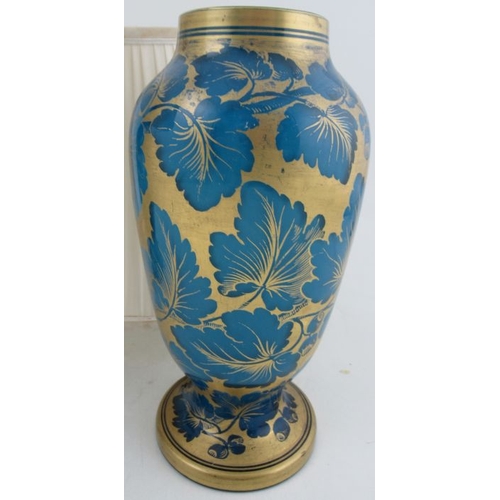 341 - A pair of blue glass lamp bases, with gilt leaf decoration, one drilled, height of vases 10ins