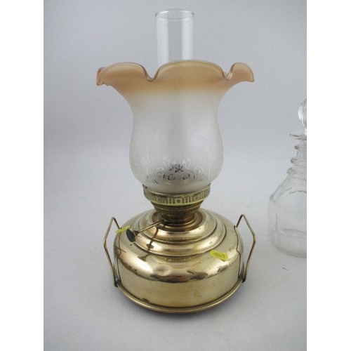 346 - An oil lamp and three decanters