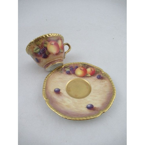 382 - A Royal Worcester cabinet cup and saucer, decorated with hand painted fruit, signed N.Creed