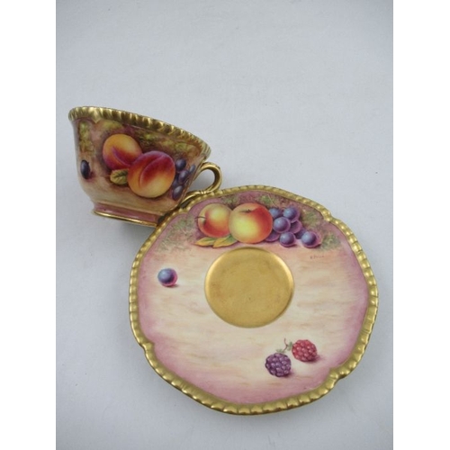 384 - A Royal Worcester cabinet cup and saucer, decorated with hand painted fruit, the cup, signed N.Creed... 