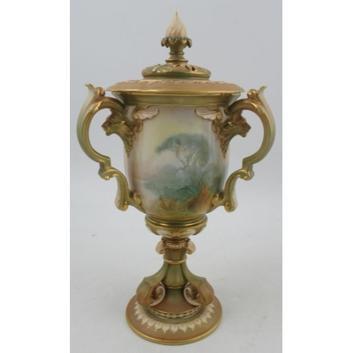 387 - A Royal Worcester after Hadley covered vase, having three handles, decorated with panels of storks b... 