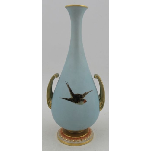 397 - A Royal Worcester club shaped vase, decorated with five swans to a powder blue ground with gilded ru... 