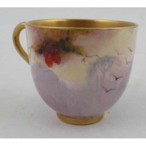 400 - A Royal Worcester miniature coffee cup and saucer, the cup and saucer decorated with a peacock and p... 