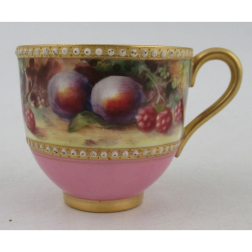 403 - A Royal Worcester miniature coffee cup and saucer, decorated with a band of fruit to a mossy backgro... 