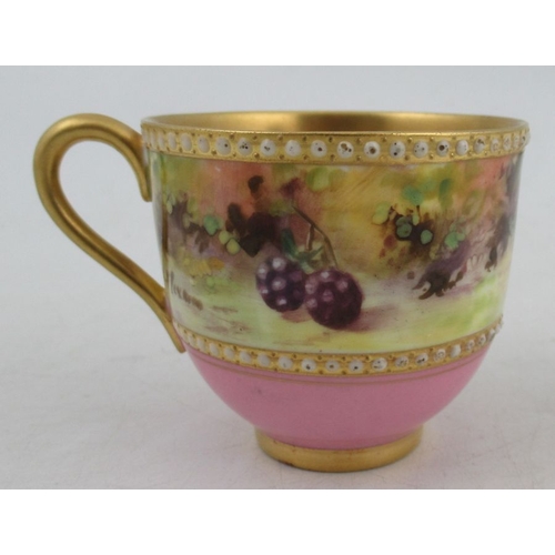 403 - A Royal Worcester miniature coffee cup and saucer, decorated with a band of fruit to a mossy backgro... 