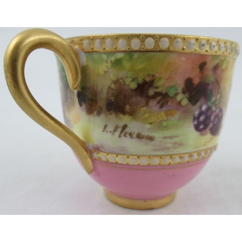 403 - A Royal Worcester miniature coffee cup and saucer, decorated with a band of fruit to a mossy backgro... 