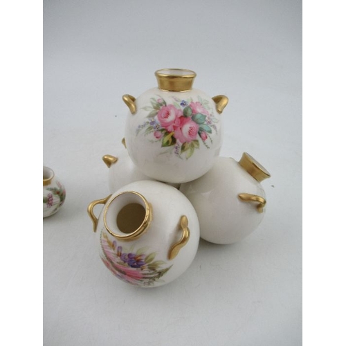 408 - A Royal Worcester four piece globular vase, decorated with flowers, height 6ins, width 6ins together... 