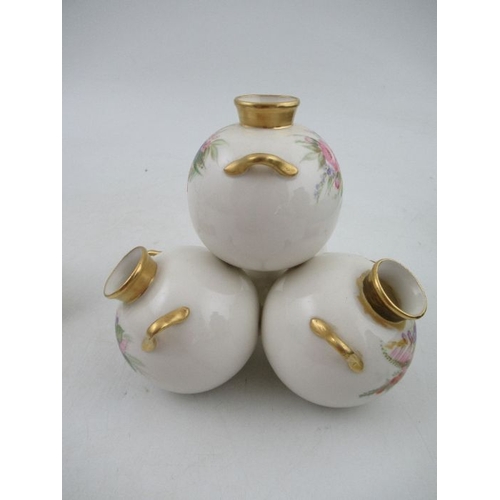 408 - A Royal Worcester four piece globular vase, decorated with flowers, height 6ins, width 6ins together... 