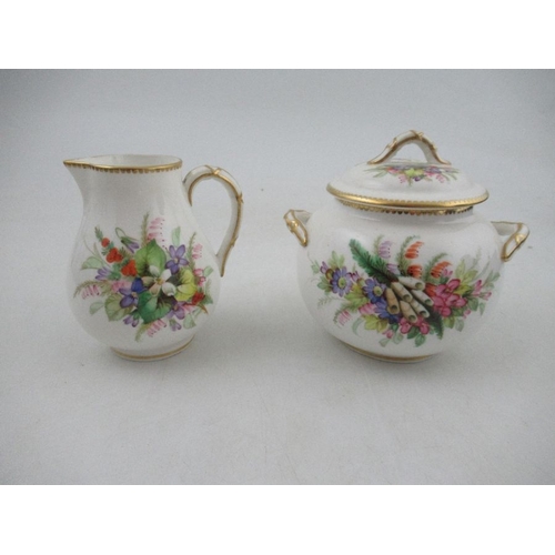 412 - A Royal Worcester tea pot, decorated with hand painted flowers to a white ground, together with a ma... 