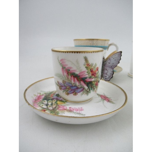 414 - A 19th century Royal Worcester cup and saucer, decorated with floral sprays, with stylised butterfly... 