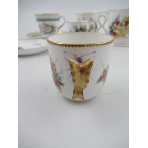 414 - A 19th century Royal Worcester cup and saucer, decorated with floral sprays, with stylised butterfly... 