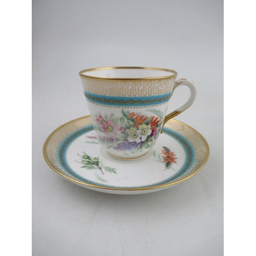 414 - A 19th century Royal Worcester cup and saucer, decorated with floral sprays, with stylised butterfly... 