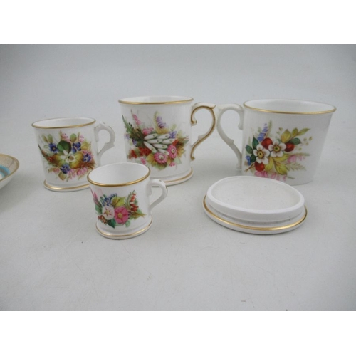 414 - A 19th century Royal Worcester cup and saucer, decorated with floral sprays, with stylised butterfly... 